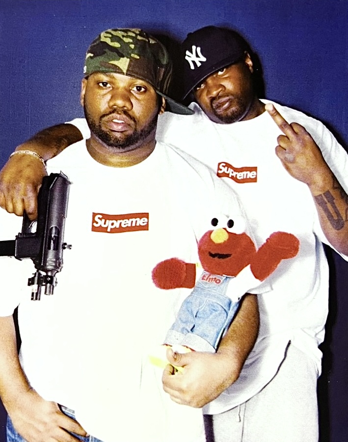 Raekwon and his Bodyguard Posing with Elmo and a TEC-9 for [Supreme], 2005